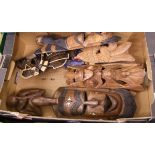 A mixed collection of items to include : African and Indonesian carved wood masks