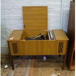 A G. Marconi radiogram in teak case with Garrard turntable.