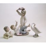 Lladro figure of a goose: together with Nao figural group and a Nao baby figure (3).