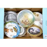 A mixed collection of decorative wall plates: