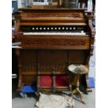W Doherty & Co walnut cased Edwardian pump organ: