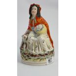 Staffordshire figure of a Welsh lady with a dog: ( dog has 1 ear missing)