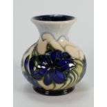 Moorcroft vase decorated with blue flowers: dated 2005. Height 9cm.