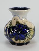 Moorcroft vase decorated with blue flowers: dated 2005. Height 9cm.