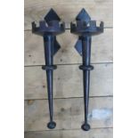 A pair of wrought iron candle wall brackets, height 37cm.