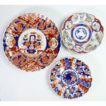 A collection of Japanese imari decorated plates: together with chargers ( some damages).