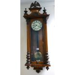 Early 20th Century Vienna wallclock: carved walnut cases with eagle to cornice. height 127cm.
