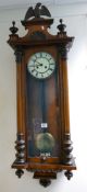 Early 20th Century Vienna wallclock: carved walnut cases with eagle to cornice. height 127cm.