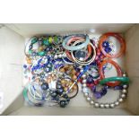 A collection of vintage costume jewellery: including bangles,