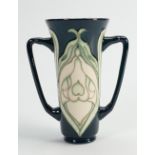 Moorcroft twin handle trumpet vase in the snowdrop design: Moorcroft collectors club piece .