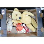 A vintage straw stuffed teddy bear: together with Japanese dolls