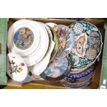 A large collection of decorative wall plates: oriental items noted