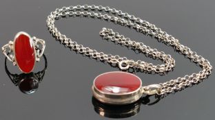 Silver locket, necklace and matching ring: both set with brown stone, 10g.