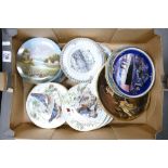 A mixed collection of decorative wall plates: