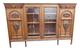 Edwardian carved Walnut Side Cabinet by Jas Shoolbred and Co: 187cm wide x 124cm high x 41cm deep.