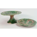 19th century Majolica tazza and plate: Each decorated with leaves, tazza diameter 22.5cm.