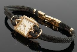 9ct gold ladies Rolex cocktail watch: With black lace strap and rolled gold clasp, boxed.