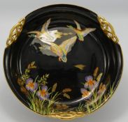Carltonware fruit bowl decorated with enamelled flying mallard ducks: On black ground,