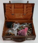 A collection of vintage ladies costume jewellery in old leather case: