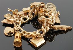 9ct gold bracelet with 20 good 9ct gold charms: Including Concorde, Toby jug, miners lamp etc., 93.