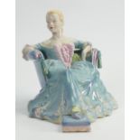 Wade underglazed figure of a lady in a dress seated on an armchair: Height 18.5cm.