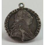 George III silver coin dated 1787: Later clasp attached.