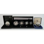 A collection of Royal Mint Proof coins: Comprising Britannia silver four coin set with box and cert,