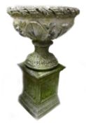 Large stone 2 piece garden planter: Decorated with foliage, height 90cm.