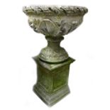 Large stone 2 piece garden planter: Decorated with foliage, height 90cm.