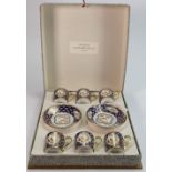 Boxed Bernardaud Limoges cobalt blue and gilt glazed coffee cans and saucers: Each with gilded