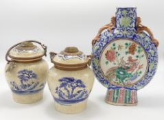 A collection of Chinese porcelain crackle glazed vases: comprising two handled flask and pair