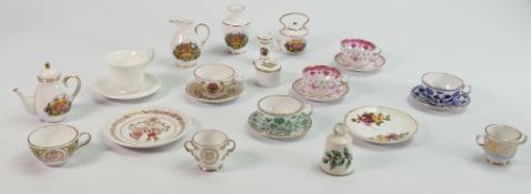 A collection of Spode miniature tea ware: Comprising various cups & saucers, tea pots, jugs etc.