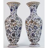 Pair of 19th century porcelain vases: Both decorated with scrolling foliage with crossed flag back
