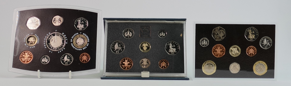 A collection of Royal Mint proof coins: Including 2004,2000 & 1990 UK proof coin collections,