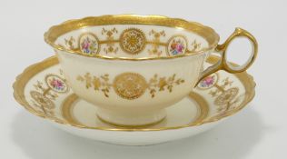 Early 20th century Cauldon pottery gilded cabinet cup and saucer: Decorated with flowers.