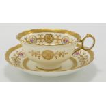 Early 20th century Cauldon pottery gilded cabinet cup and saucer: Decorated with flowers.