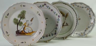 Four 19th century Tin glazed Dutch plates: Decorated in traditional styles: Diameter 23cm.