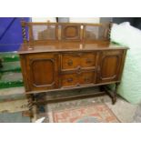 Oak early 20th Century sideboard: with inset bergere handles