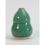A Chinese monochrome green double gourd vase: height 10cm