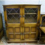 An oak veneered side cabinet.