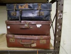 Three vintage suitcases: in stressed state