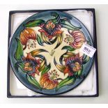 Moorcroft Anna lily plate: dated 1999, boxed. Diameter 22cm