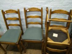 An oak set of 4 upholstered dining chairs.