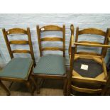 An oak set of 4 upholstered dining chairs.