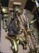 A mixed collection of items to include: brass ornaments, brass eagle, miner figure etc.