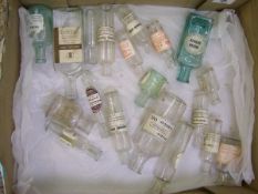A collection of vintage glass pharmacy bottles: with labels. Approx 20