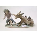 Lladro figure of a boy with a stubborn donkey and dog: model 5178