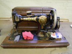 Cased Jones' family cs sewing machine: