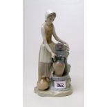 Lladro / Nao figure of a lady collecting water: