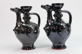 A pair of studio pottery black dragon jugs: height 23cm
